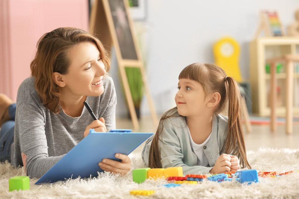 Adult and child during play therapy